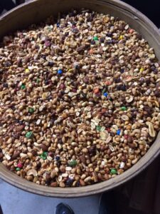 Trail mix is one of the most common and effective bear baits used by bear hunters. It's beneficial to the bears and the small amounts of M&Ms and chocolate chips are not enough to harm wildlife. An overreaction by state game departments to ban this would be a big mistake. 